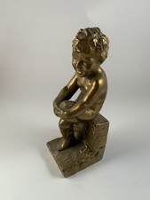 Gold Smiling Boy Sitting On A Block Bookend   8  Tall Metallic Brass Ceramic 