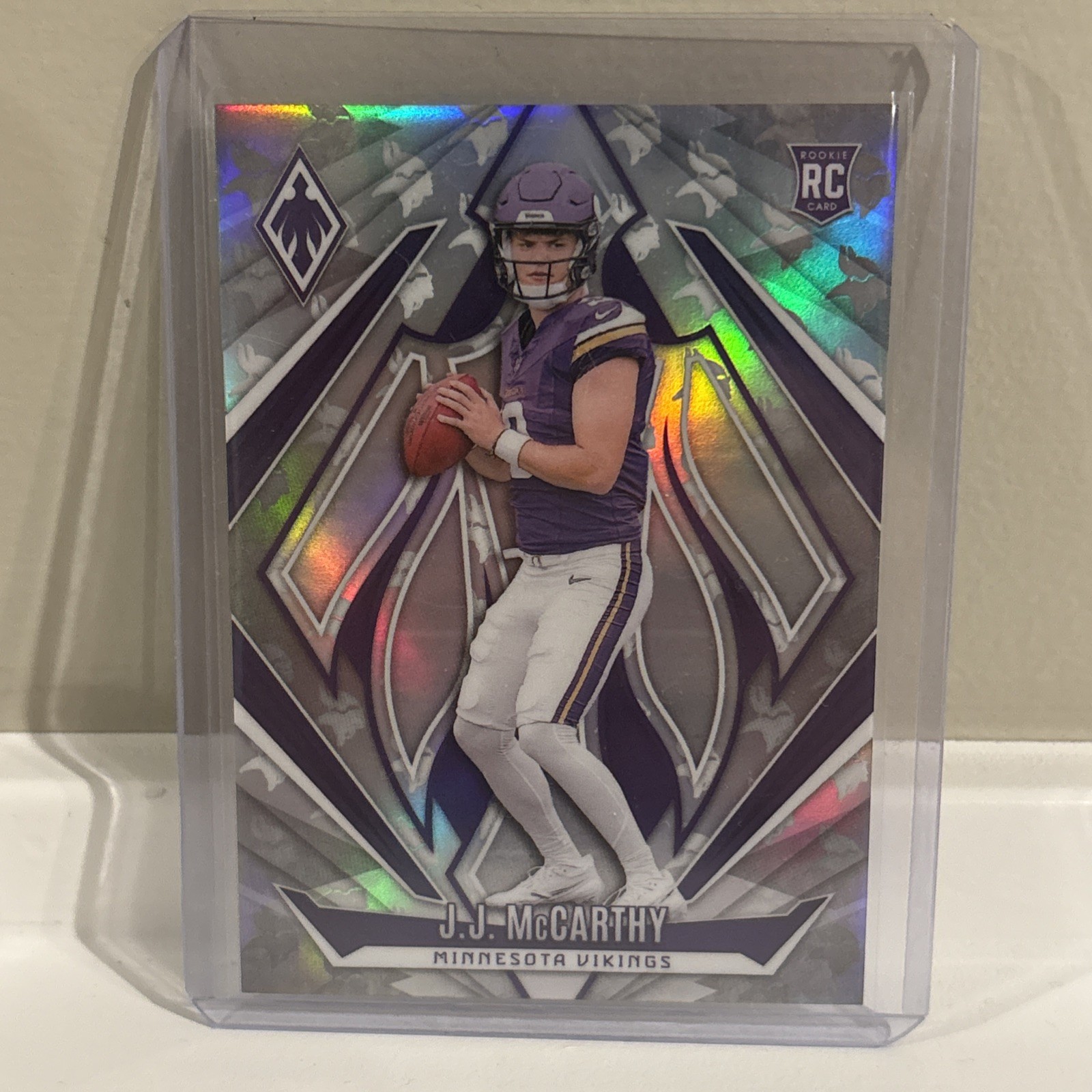2024 Panini Phoenix - Rookies J.J. McCarthy #185 Team Logos /299 Vikings