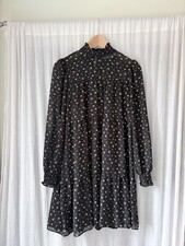 Michael Kors black floral dress with ruffle hem and long sleeves. Size: S