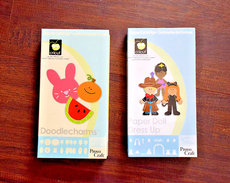 Lot of 2 Cricut Cartridges: Paper Doll Dress Up & Doodlecharms by Provo Craft