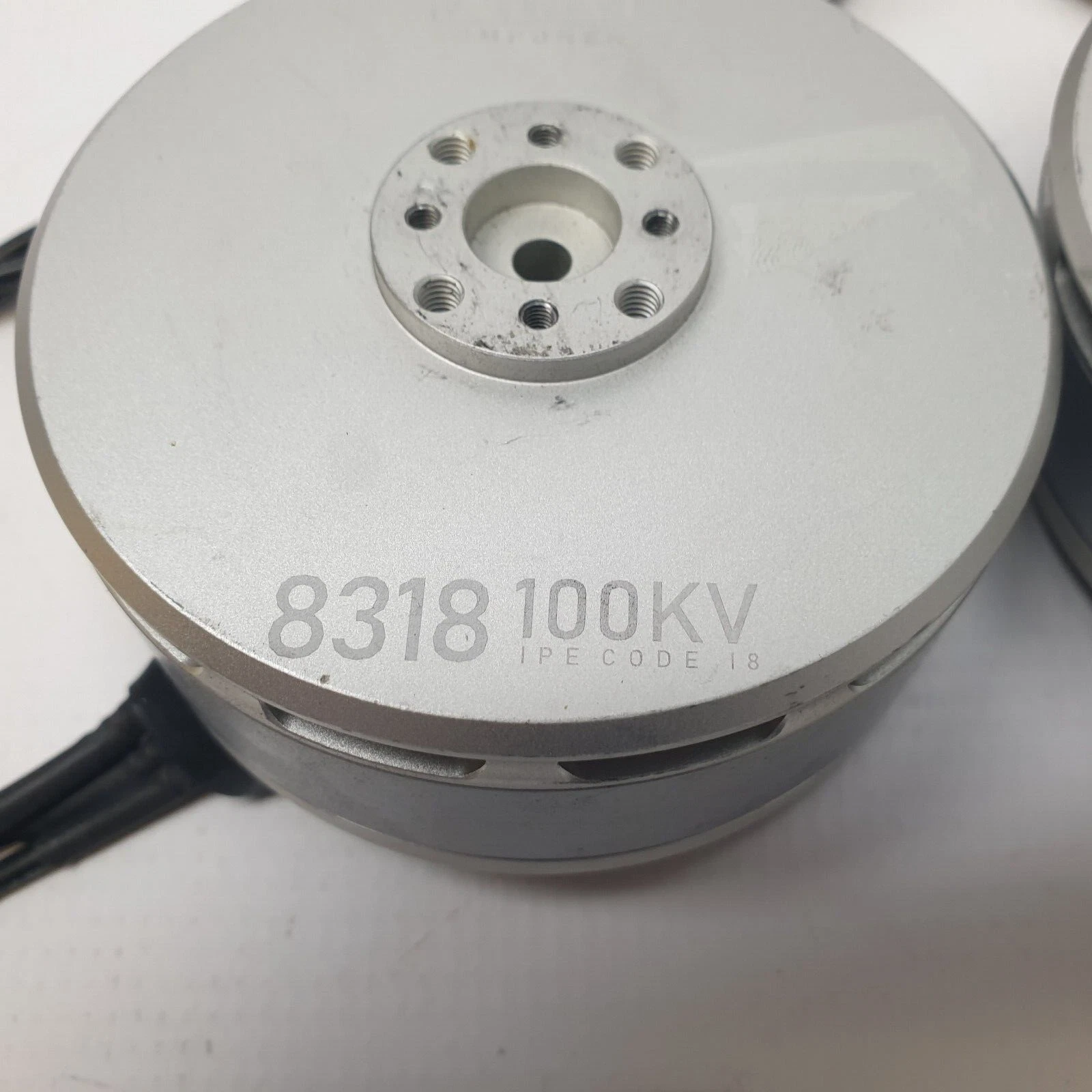 8318 100KV marking on the silver housing of a MIAT brushless motor