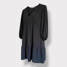 black tiered dress from LOFT with a v-neck and 3/4 length sleeves. 8 Minimalist