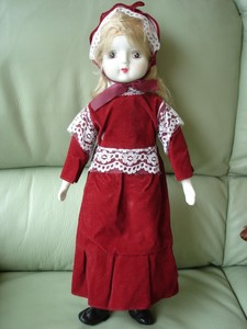 porcelain doll red velvet dress