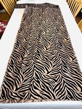 Remnant black zebra "flocked" pattern on bronze taffeta-like fabric, 59"Wx69"L