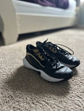 Under Armour Lockdown 7 Black Gold White Athletic Low Top Shoes Unisex Kids