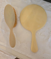 VINTAGE CELLULOID HAND MIRROR AND HAIR BRUSH BAKELITE