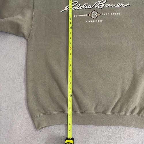 Gray vintage Eddie Bauer sweatshirt size L with yellow vertical measuring tape and black “Eddie Bauer Outfitting Since 1920” text.