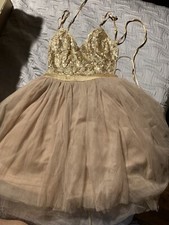 Fashion Nova size Small Or Medium gold sequin and tulle dress. State Size Email