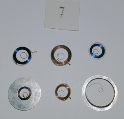 PIECE HORLOGERIE MONTRE UN RESSORT DE BARILLET HAUTEUR 15 DIAMETRE 10
