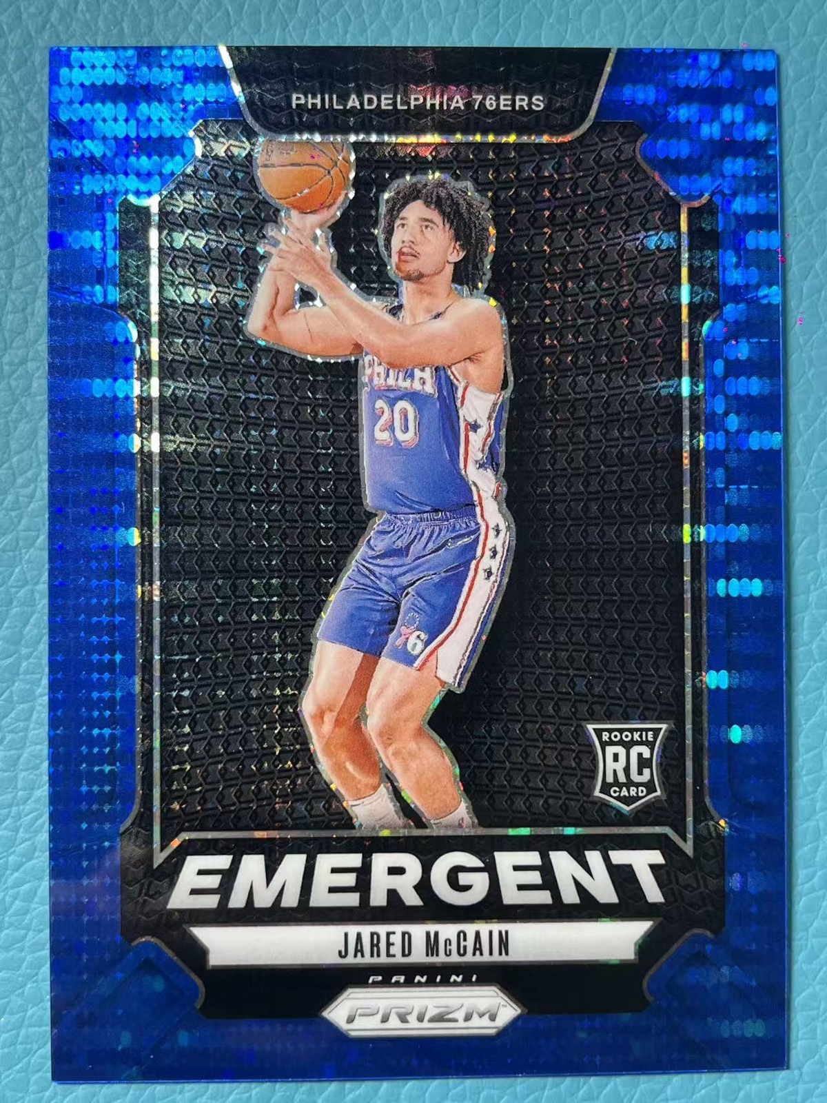 Jared Mccain 2024-25 Panini Prizm 90/99 Blue Pulsar Emergent RC 76ers #19