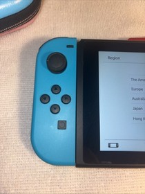 Nintendo Switch HAC-001 Neon Red/Blue JoyCons W/ Peach Case And 4 Games. EUC