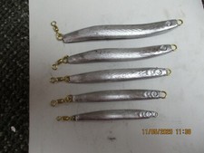 un-painted  raw bent sand eel, dart eel jig, casting jig striper, fluke  no hook