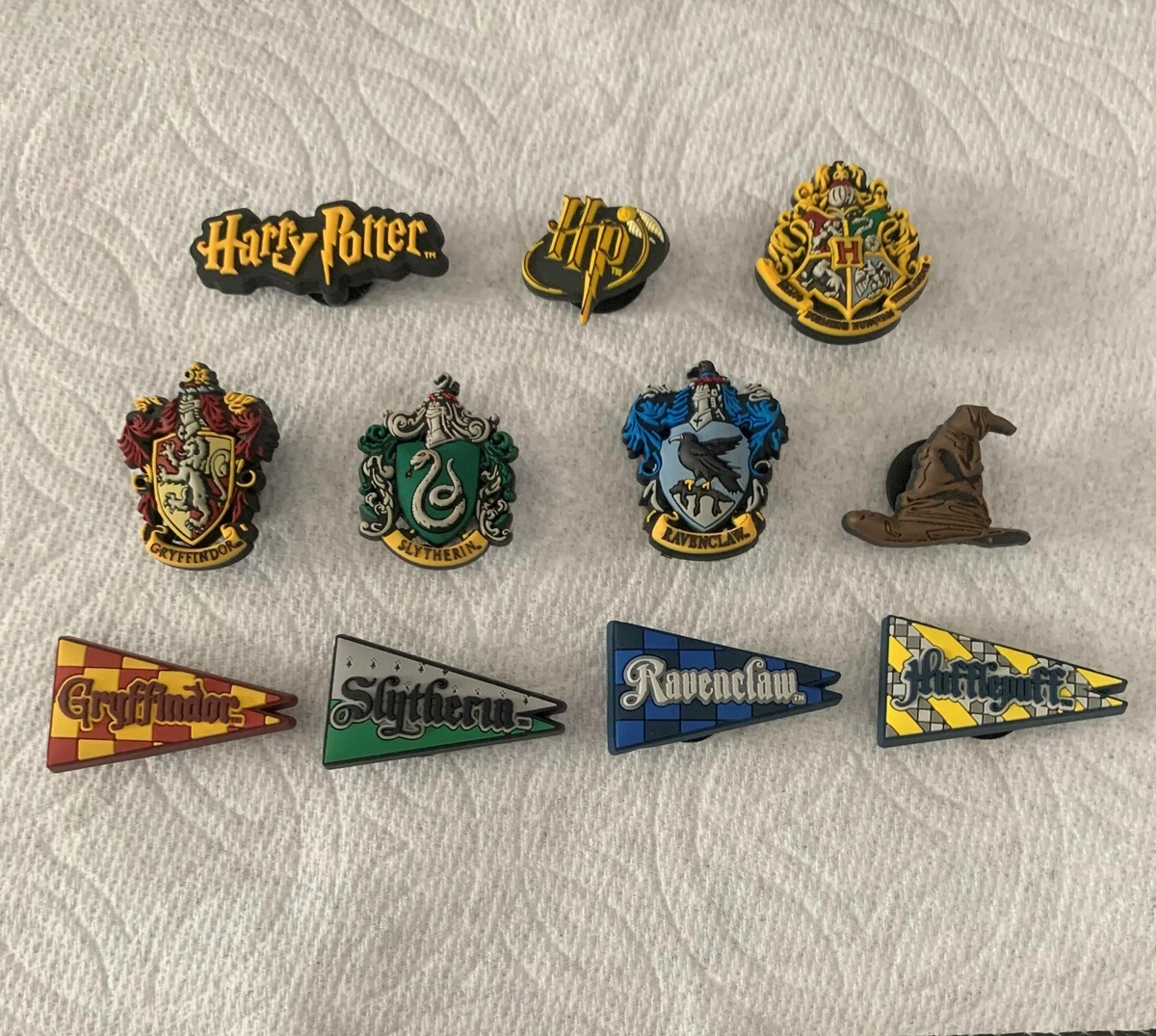 6 Harry Potter croc charms.