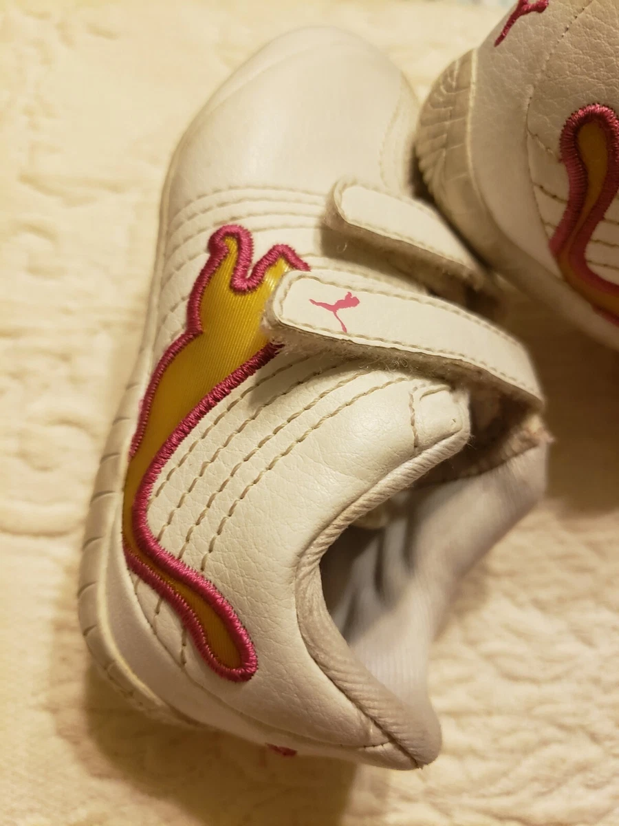 Pink white and gold pumas discount
