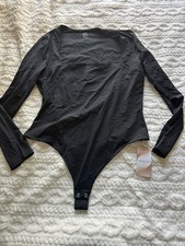 Black long sleeve square neck double lined bodysuit. Brand new with tags.