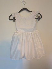 Ivory satin flower girl dress with ruffle sleeves, large v back , and bow