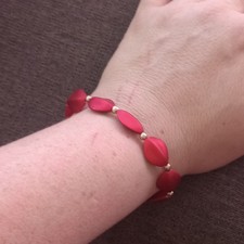 Red Plastic Oval Beaded Stretch Bracelet, Ela...
