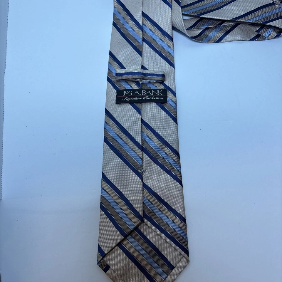 Corbata de seda Jos A Bank para hombre - Colección ejecutiva a rayas tostadas y azules, usada Foto 4 de 4