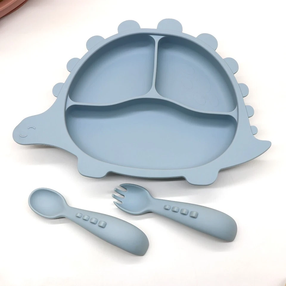 platos de silicona para bebe dinosaurio de tres colores verde, rosa y celeste Foto 2 de 3