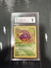 Ekans, 1999 Pokemon Fossil 1st Edition Card 46/62. CGC 8 NM/Mint