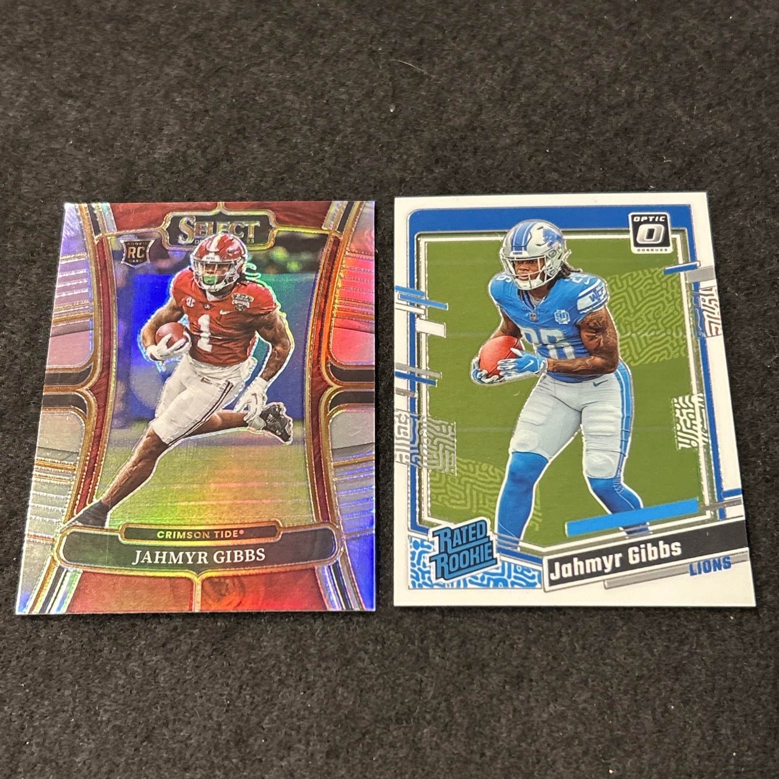 2023 Jahmyr Gibbs Optic Rated Rookie #236 & Select Draft Picks Silver #10 (RC’s)