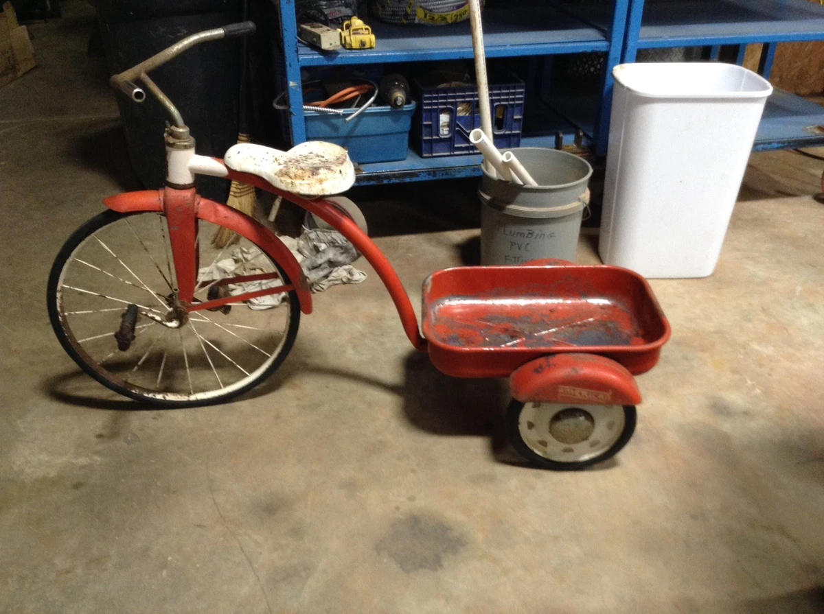 Antique tricycle with wagon clearance attached