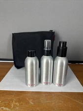 Tumi Travel Sized Toiletry Bottles and Pouch Set Of 4 Unused
