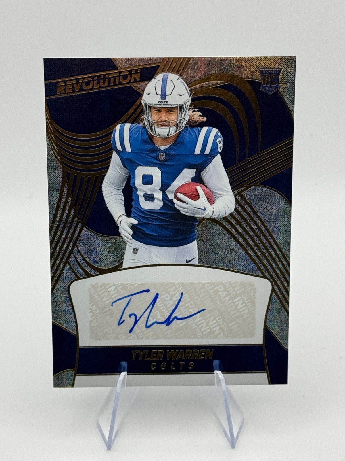 2025 Panini Revolution - Rookie Autographs Tyler Warren #RA-TWN /299 (AU, RC)