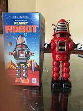 Forbidden Planet s mechanical Robby Robot with box and wind-up key.