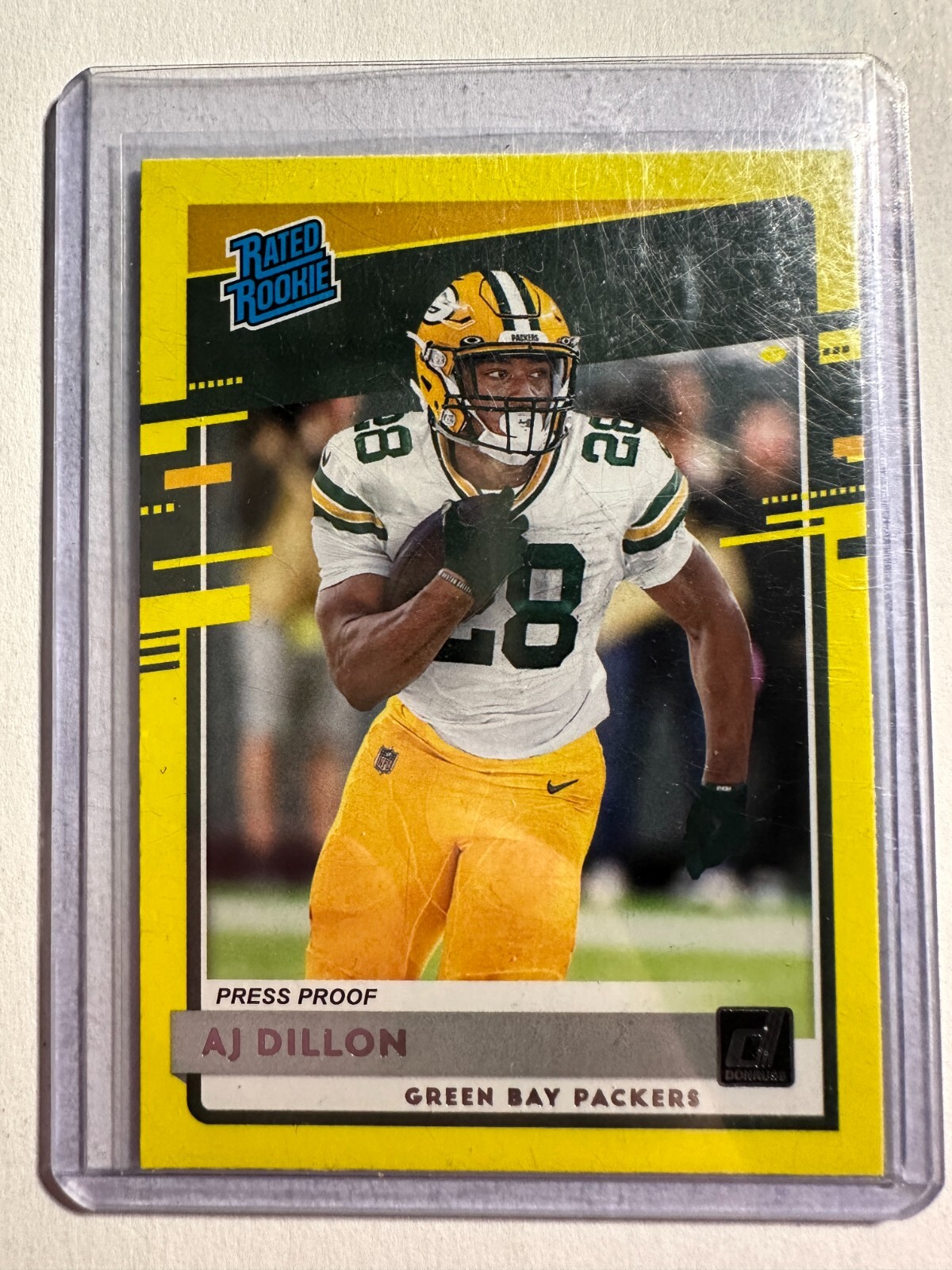 K102,881 - 2020 Donruss Press Proof Yellow #324 A.J. Dillon RR