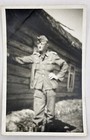 World War Two in Photographs Military Man Stands W/ Hand Upon Cabin Other On Hip