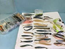 Slug Go Bait Fish and Few Lures and Other Hooks in Plano Box