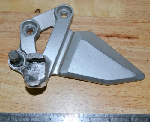 BRACKET, FRONT FOOTREST LH *{MODEL K4}*