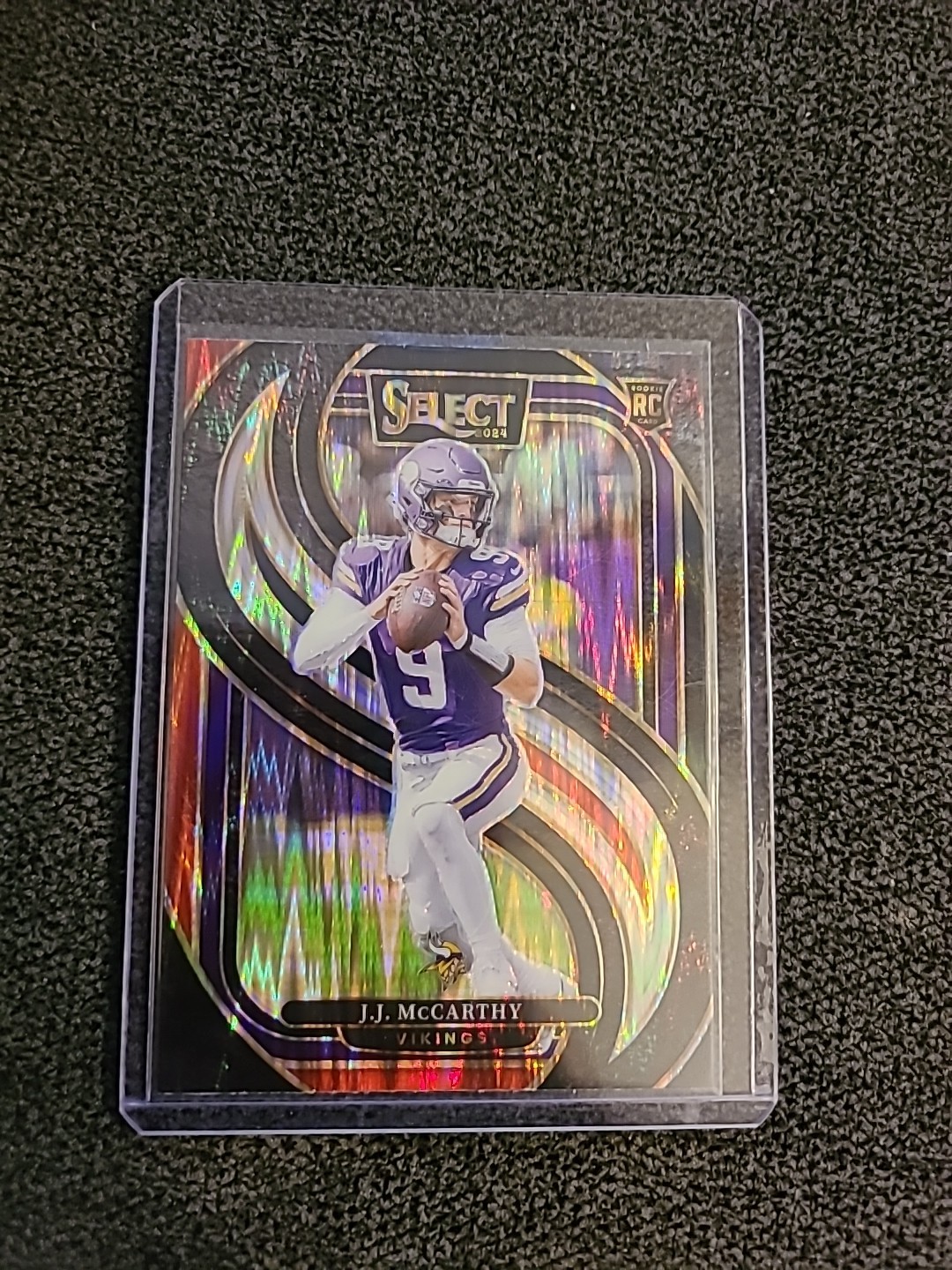 2024 Panini Select - Premier Level J.J. McCarthy #134 Black & Red Shock Prizm RC