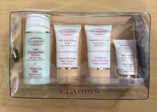 Clarins Paris - Sample Gift Set - Cleansing Milk, Day Cream, Neck Cream, Balm