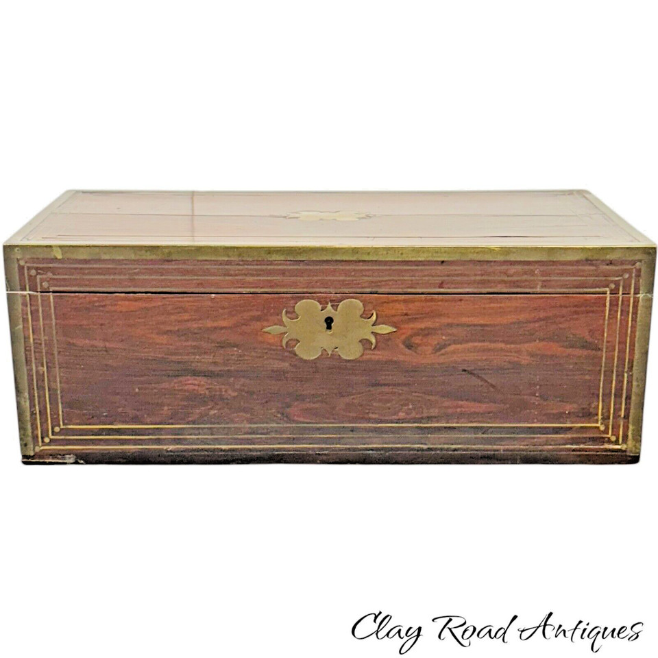 A genuine 1800s Edwardian rosewood lap desk with brass inlay — a portable writing box from a era when letters were an art form, still beautiful and functional today.