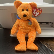 TY BEANIE BEAR' 2003  DECADE IN RARE ORANGE BEAR'' BORN JANUARY 22, 2003