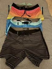 Hurley board shorts Youth 10/25-three pack for less. Tie front, mid length