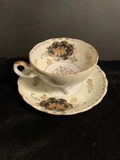 Vintage Royal Sealy China 3 Footed Tea Cup And Saucer Iridescent Black & Gold