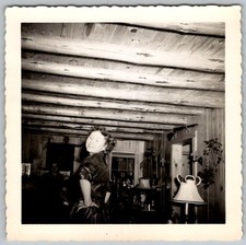 Vtg B&W Snapshot Smiling Young Woman In Rustic Log Cabin Interior Decor 1950s