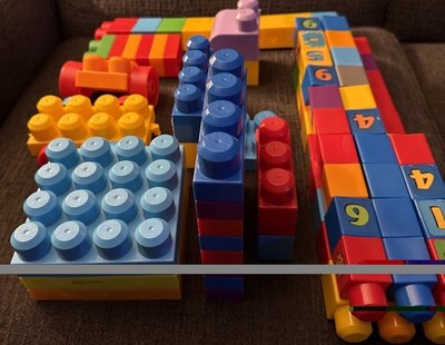 (89 Pc) Lot of Assorted Mega Bloks,Sizes,Colors,Some With Wheels.