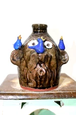brian wilson  (RARE  blue bird face  jug)  , folk art   8'' tall x 6'' wide