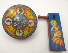 2 Vtg Tin Litho Noisemakers w/ Wooden Handles Dancers Clowns Circus EXCELLENT