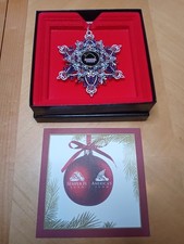 Snowflake ornament geocoin with the text "SEMPER FI FUND" in the center w/ Box