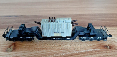 Minitrix 3298 Tiefladewagen, Gattung SSt, 6-achsig, schwarz, mit Trafo (grau) | Condition: Gebraucht