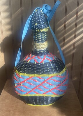 70s plastic wicker wrapped yellow/black and Redish colors decanter  bottle