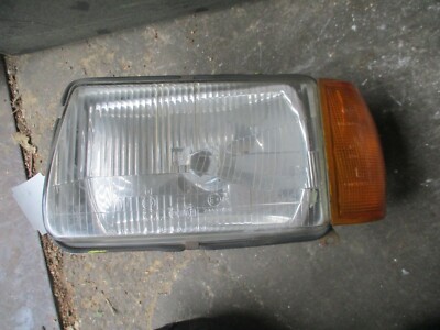 Audi 100 C2 Typ 43 Scheinwerfer vorne links head light H4 Hella 24448R7