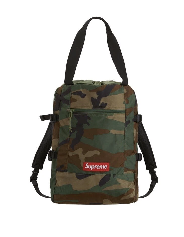 Sac fourre tout Supreme Sac à dos Woodland Camo SS19 flambant neuf avec sac et autocollant