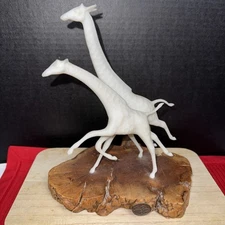 John Perry Giraffe Sculpture Hand 1992 mother giraffe and her calf in motion.