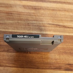 Cartucho de juego Acclaim Tiger-Heli Nintendo NES con cubierta antipolvo NTSC-U/C 1987